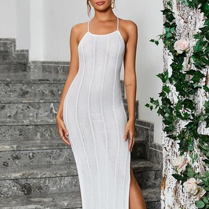 Detail of white knit halter maxi dress with side slit and vertical ribbed texture
