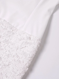 Detailed macro view of white smocked fabric and smooth stitch texture on a summer dress