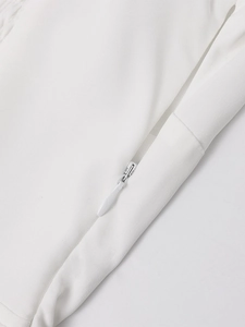 Detailed macro view of white dress with hidden side zipper and premium stitching