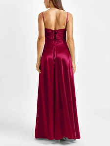Detailed back view of the burgundy satin gown featuring an adjustable lace-up corset tie