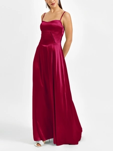 Detail of burgundy matte satin dress showing diamond stitching and waist texture