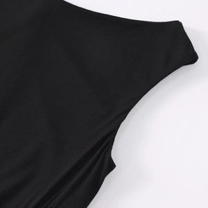 Close-up of the smooth black modal fabric stitching and seam detail of the dress