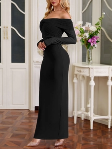 Detail view of the elegant mesh pleats and off-shoulder design on a slim black dress