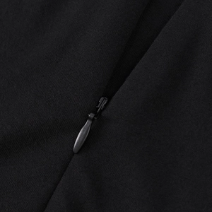 Macro detail of high-density knit fabric and invisible zipper on black bodycon dress