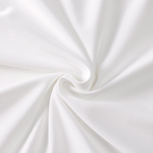 Detailed macro view of white milk silk knit fabric texture with satin gloss and soft drape