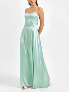 Detail of mint green satin maxi dress showing silky fabric texture and side silhouette