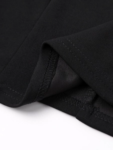 Close-up of black summer dress hem showing double-stitched seams and quality fabric