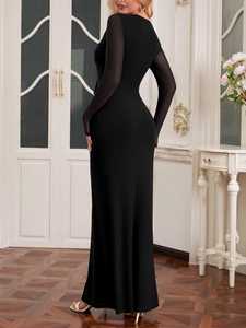 Détails des manches élégantes en tulle noir et coupe ajustée d'une robe longue de soirée