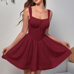Deep burgundy backless A-line mini dress with bow tie detail and tiered ruffled hem