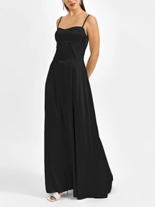Detail of the waist geometric stitching on a black matte satin maxi slip dress