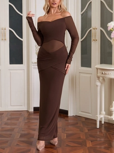 Detail of sheer mesh patchwork and ruched texture on a dark brown bodycon dress