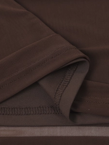 Detailed close-up of dark brown mesh fabric texture with precise hem stitching and sewing