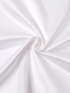 Macro shot of white satin fabric texture with elegant silky folds and glossy finish
