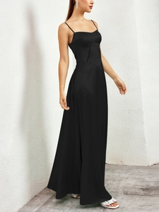 Detail of elegant black matte satin maxi dress with thin straps and sleek A-line silhouette