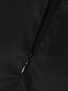 Close-up of black matte satin dress showing high-quality invisible zipper detail