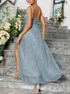 Detail of light blue metallic evening dress with thin straps and high side slit design