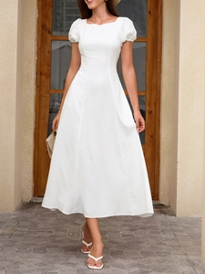 Close-up of elegant puff sleeves and square neckline on a white summer A-line dress