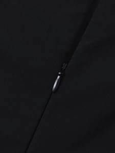 Detail of the high-quality invisible zipper on a black tencel sleeveless dress