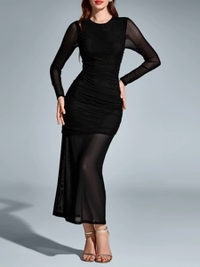 Detail of ruched mesh design and sheer sleeves on a slim fit black long dress