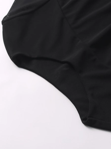 Close-up detail of the black mesh fabric with reinforced stitching and soft texture