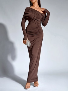 Detail of elegant chocolate off-shoulder dress featuring ruched texture and thumbhole sleeves