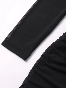 Detailed view of the sheer black mesh sleeve with fine ruched fabric and quality stitching