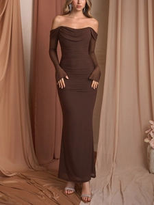 Close-up of ruched mesh fabric and elegant off-shoulder long sleeve dress details
