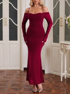 Close-up of wine red off-shoulder dress featuring ruched details and mesh long sleeves