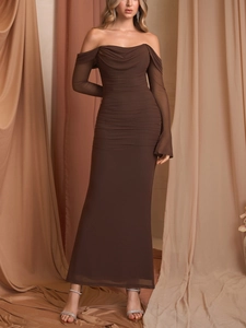 Detail of sheer mesh ruched fabric on a dark brown off-shoulder evening maxi dress