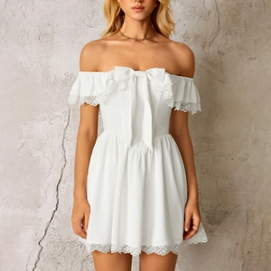Elegant white lace trim strapless dress with bow accent and A-line mini skirt silhouette