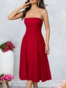 Detailed view of the red strapless midi dress featuring a pleated waist and A-line silhouette