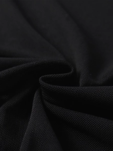 Macro shot of black mesh fabric showing breathable knit texture and pleated structure