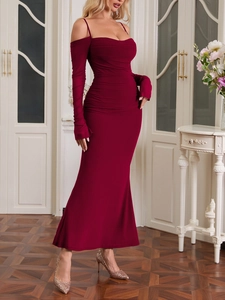Detail of elegant burgundy mesh dress with off-shoulder straps and ruched bodycon design
