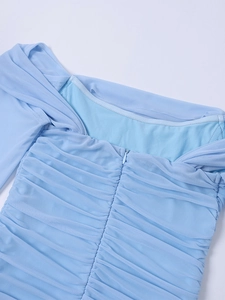Detail view of sky blue mesh ruching dress with a matching concealed zipper on the back
