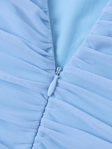 Detail of light blue mesh fabric with fine pleats and a matching invisible zipper