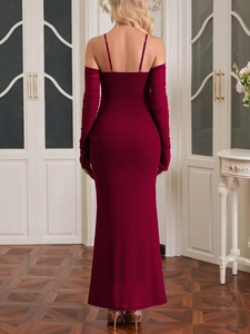 Rear view of a burgundy off-shoulder evening gown with long sleeves and floor-length hem