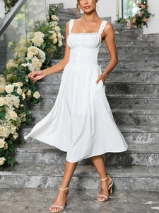 Detailed view of white lace trim and button decorative bodice on an A-line dress