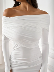 Detailed view of ruched crossover chest design on a white off-shoulder long sleeve dress