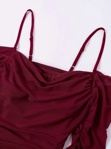 Detail of wine red mesh camisole featuring adjustable straps and elegant side ruching