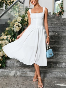 Close-up of white lace trim square neckline and button details on sleeveless A-line dress