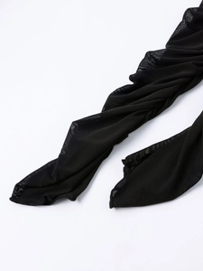Detail shot of sheer black mesh fabric on long sleeves with fine textured breathable finish