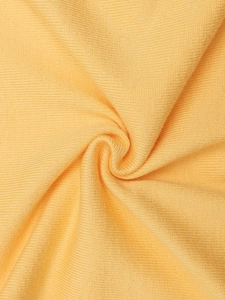 Detailed close-up of yellow ribbed knit fabric showing soft texture and elastic weave