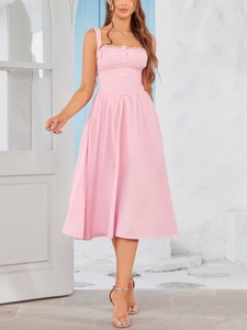 Close-up of pink lace-trimmed neckline and button detail on an A-line maxi dress