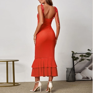 Red knit beach maxi dress featuring backless tie-up design and ruffled mermaid hemline