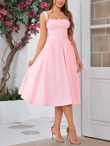 Close-up of lace trim neckline and decorative buttons on a light pink A-line midi dress