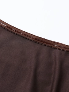 Close-up of non-slip silicone strip on mesh dress neckline for secure fitting
