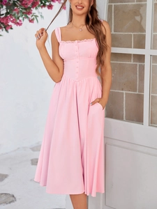 Detail of pink lace-trim dress featuring decorative buttons and functional side pockets
