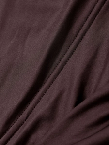 Detailed view of dark brown mesh fabric texture with high-quality stitching and silk finish