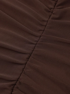 Detailed macro view of dark brown ruched mesh fabric with vertical stitching and sheer texture