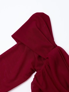 Close-up of wine red mesh fabric showing detailed ruched texture and sheer material